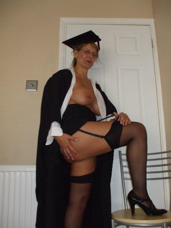 British busty MILF dressed as a school mistress