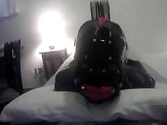 Laura is hogtied in falim sxs catsuite and high heels, throated with a lip open mouth gag POV