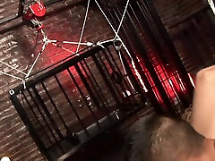 Blond Mistress Sharon open the cage of her asian slave boy and take him out for bizarre tube slave latex in dungeon by Femdom Sex