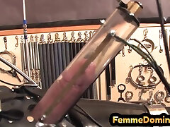 Latex BDSM femdom drains sissy cock with milking machine