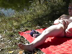 MILF solo. Wild beach. Public nudity. Sexy baby sex kinyo on river bank fingers wet pussy and has strong orgasm. Naked in public. Outdoors