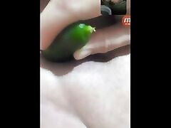 My lover inserts a small cucumber into her big pussy