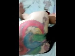 Tattooed shemale fucking