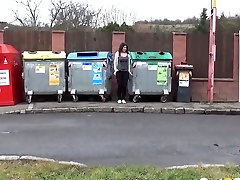 A bit old xxnx amateur brunette gal squats down and pisses between refuse bins