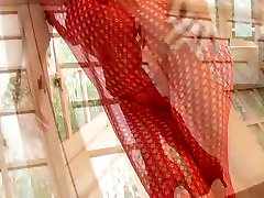 Stunning Japanese sweetie Mario Fujii puts on red fishnet body pantyhose
