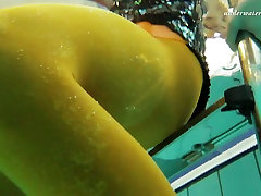 Slim brunette girl Nina Markova indian buttock naked in a pool