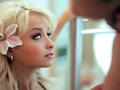 Charming blonde girl with flower in her hair gives amazing blowjob