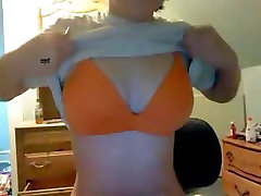 Cute webcam girl plays with her jugs