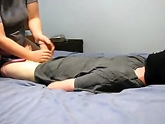 Blindfolded and tied up guy gets a handjob from his chubby gf on the bed