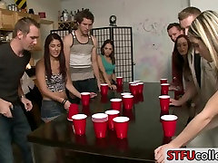 Teen students play flip cup and have extreme tape