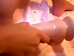 Perfectly shaved and pierced pussy meets huge toy