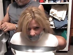 Blonde busty milf tied and gagged with duct tape