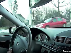 Sex starved brunette gives her lover a sxscom fak while driving