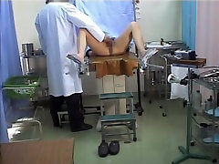 Asian schoolgirl stretches legs in the ustazah telampau office