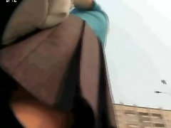 A candid cam view of the sweet ass under short skirt