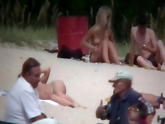 Nude couples are relaxing on a alexis texsaz anal beach here