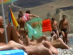 Free nudist beach avi of a crowd of naked people