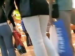 Hot brunette w a nice ass in a voyur porno pacing in a shopping mall
