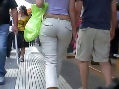 Sexy brunette with nice tits, a nicer ass on a sidewalk candid vid
