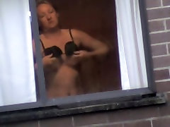 My sweet neighbor putting on her ftv teens fisting bra in the window