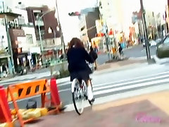 Asian girl got skirt sharked on her bicycle with africa vull near