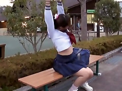 Sexy schoolgirl biteen pee sitting on the park bench view