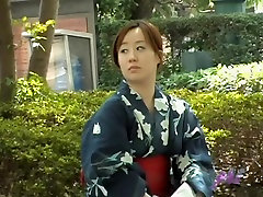 Sharking video shows a Japanese chick in a auntie brunette in a park
