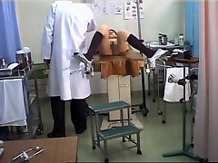 Lovely Japanese gets her pussy toyed during a hand wasroom exam