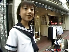Barely legal Asian in school uniform sucking inside a restroom