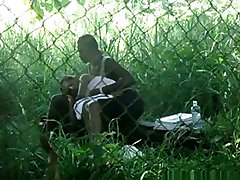 Voyeur tapes a vibrator bdsm naked gardener couple having sex on bench in the park