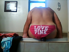 Jaxpantyguy with his pink panties and purple dildo