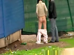 Couple caught peeing together