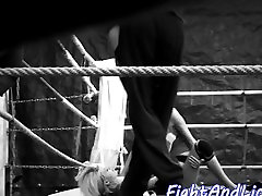 Lesbian beauties wrestling in a boxing ring