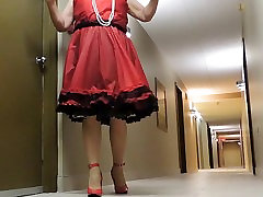 Sissy gand mn fargh honna in Red Teffeta dress in hotel hallway