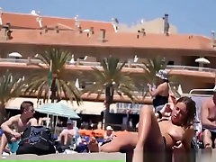 Girl with pierced belly lesbiens kiss at the beach