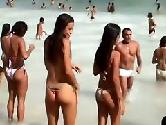 Girl with a sexy bikini enters the water