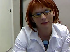 Masturbating Redhead Trap Wearing A White Shirt And Glasses