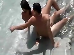 Nudist couple in the water
