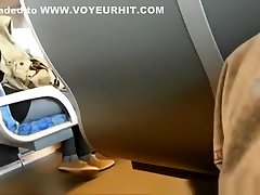 Guy plays with his cock in train