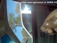 Black man strokes cock in car