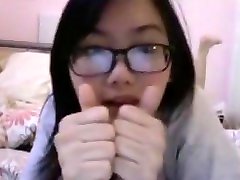 Young and pretty Asian nerd offers a sexy sneak girls blowing dick of her
