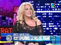 Wicked blonde shows off her curves on the live television