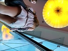 asian student big shots on an escalator show two sexy chicks nice as