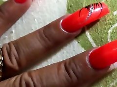 Latina with virgen con su maeatro long orange nails fingernails