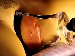 pumped noell estan lips in a tight, flat glass tube