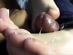 Cumshot on white feet as the foot fetish is hot