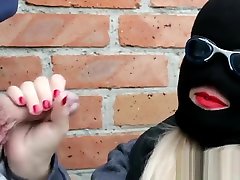 Crazy sexy girl close up makes a blowjob with a shot of cum in a black mask