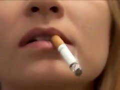 Pretty girl smoking very close-up lips and nails