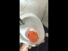 pissing in pub urinal
