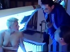 Busty blonde girlfriend sucks and fucks in a solarium